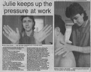 Newspaper article entitled Julie keeps up the pressure at work with picture of Julie Nicholls doing a neck and shoulder massage