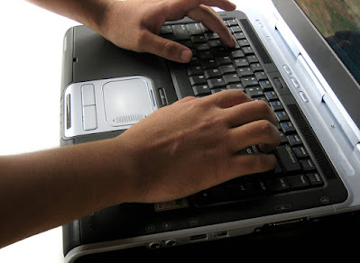 Picture of Hands On Typing On A Laptop. Cyber Bullying is a challenge to staying connected with your kids