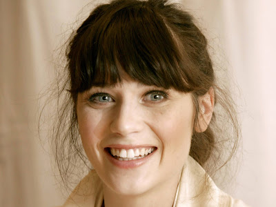 Zooey Deschanel Hot Wallpapers while she was smiling.