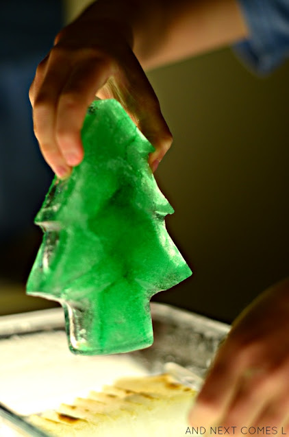 Science activities for Christmas: melting ice with salt on the light table