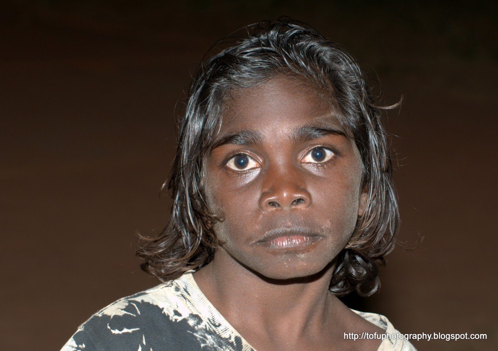 Tofu Photography An Aboriginal boy with mournful eyes in Gapuwiyak