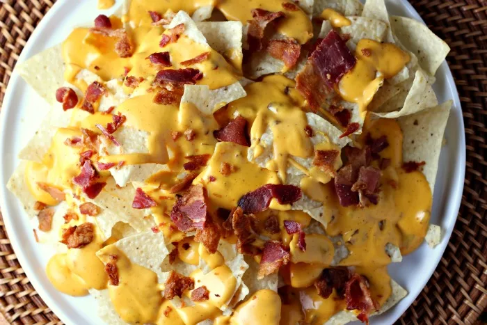 Chipotle Ranch Bacon Cheddar Nachos | by Renee's Kitchen Adventures - Easy recipe for a delicious appetizer or fun main dish the whole family will love!  Cheesy goodness with every bite! #SimmeredinTradition 