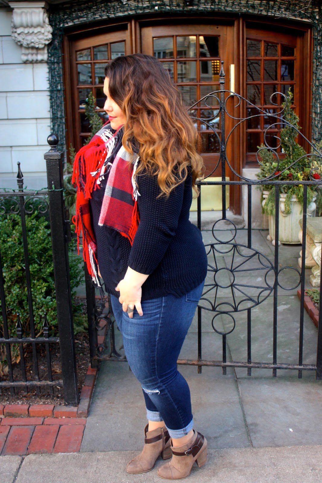 cable knit sweater, button down back sweater, red plaid scarf, fringe scarf, holiday style, natalie craig, natalie in the city, chicago, plus size fashion blogger, plus size, jeans with holes in the knees, taupe ankle boots with a brown strap, ankle booties, how to wear ankle boots, ps fashion ootd, blogger, fashion