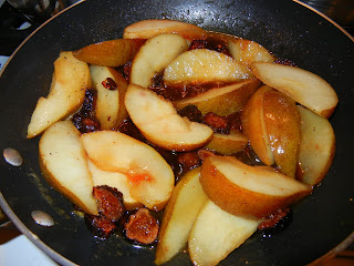 Pears and figs cooking in sauce