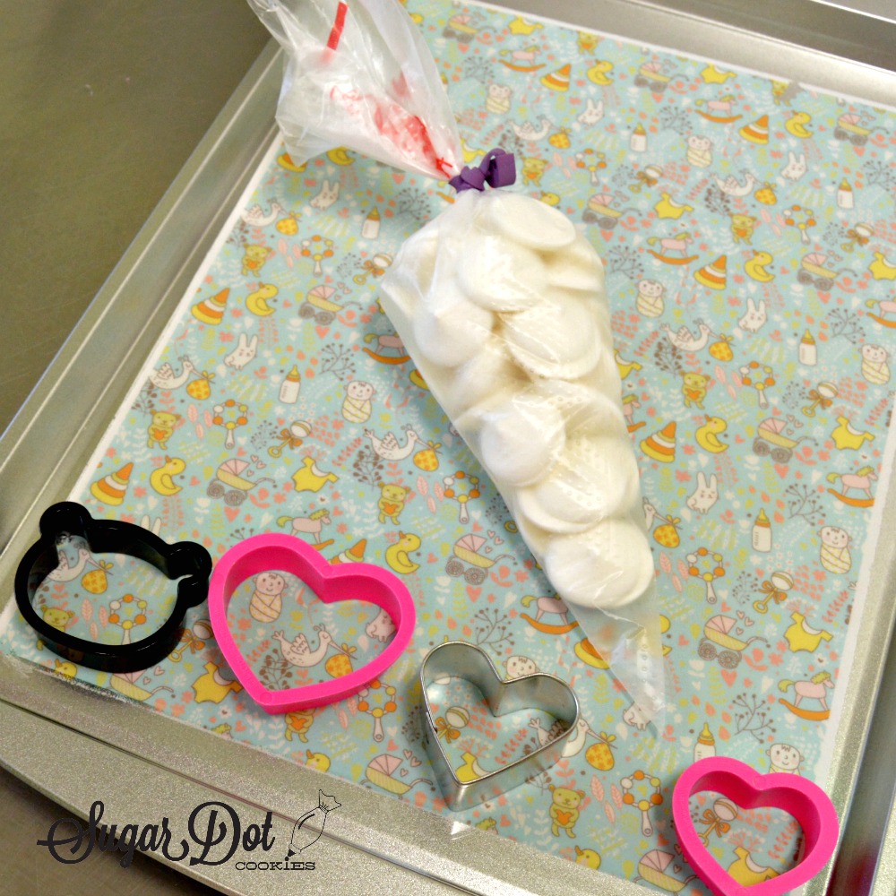 Tap the cookie tray lightly to be sure that the chocolate is touching