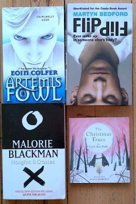 Covers for Artemis Fowl by Eoin Colfer, Noughts & Crosses by Malorie Blackman, The Christmas Truce by Carol Ann Duffy and Flip by Martyn Bedford 