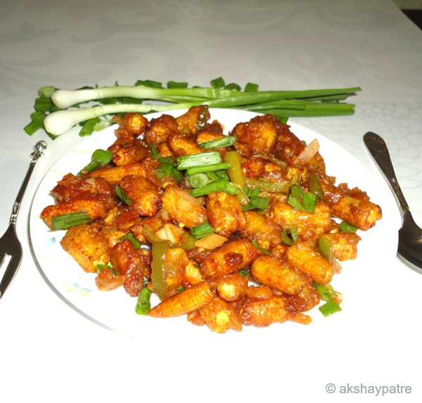 baby corn manchurian in a serving plate