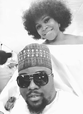 Omawumi and her husband pictured at a wedding