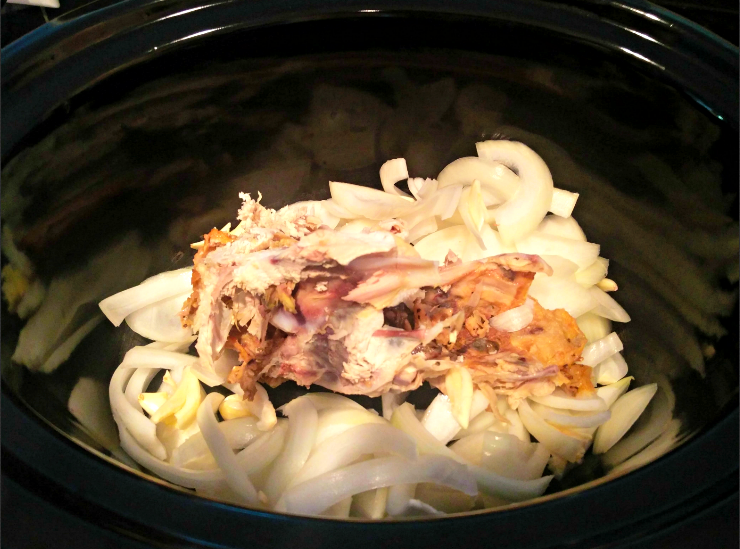 Ingredients in slow cooker for chicken broth