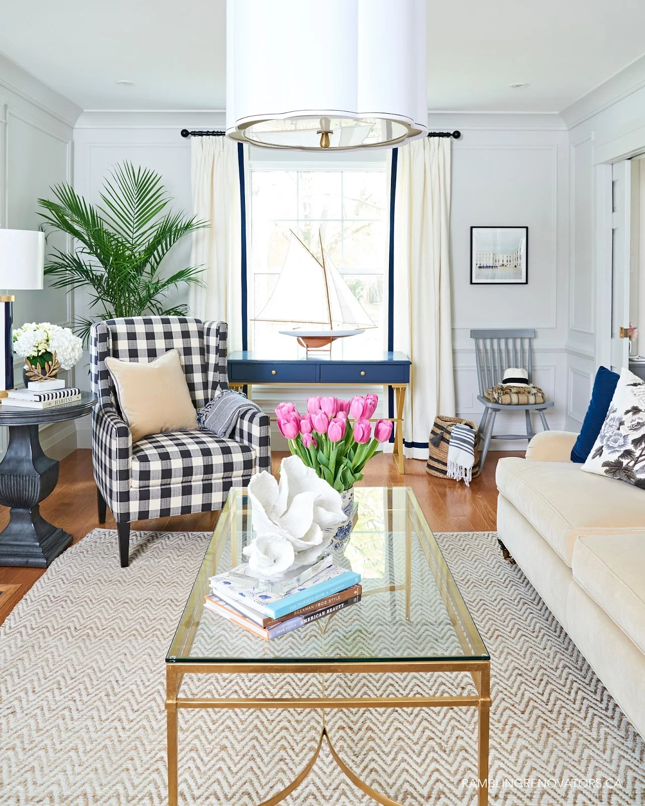 modern traditional living room, navy desk, buffalo plaid armchair