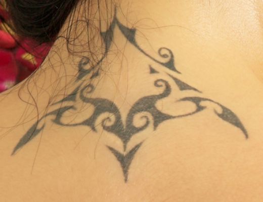 bow tattoo designs. ow tattoo on ack of neck.