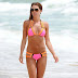 Danielle Lloyd unveils impressively toned figure in tiny unfastened bikini on break in Portugal