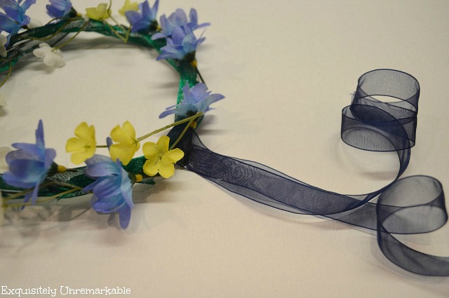 Floral Headdress With Blue Ribbon Tail