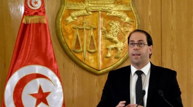 Tunisian Prime Minister Youssef Chahed, seen in August 2016, said the transition to democracy was costly for his country, which relies on France for help "at this critical moment