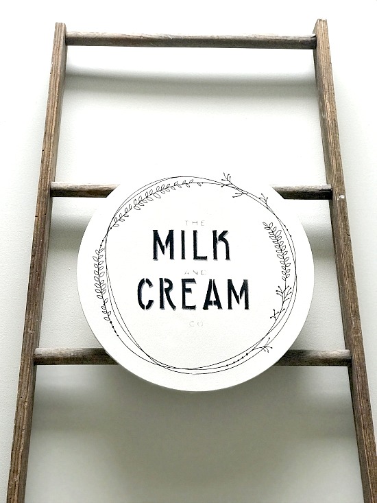 Large DIY farmhouse milk cap canvas on a ladder