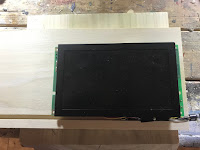 LCD Screen sitting on top of piece of birch that will be the back mount