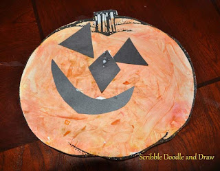 fingerpainting with kids to make pumpkin craft