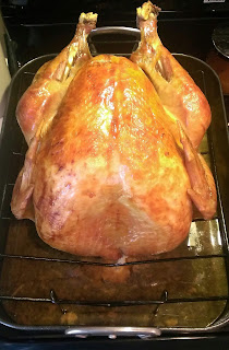 large turkey in basting pan