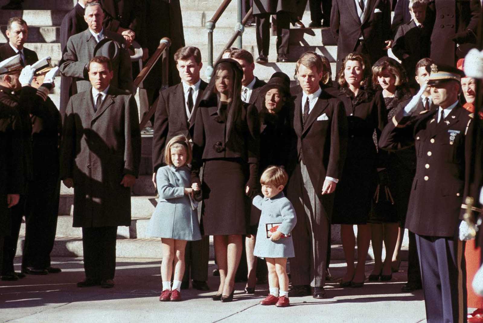 The First Family watches John F. Kennedy's funeral procession in Washington on November 25, 1963, three days after the president was assassinated in Dallas. Widow Jacqueline Kennedy, center, daughter Caroline Kennedy, left, and son John Jr., are accompanied by the late president's brothers Sen. Edward Kennedy, left, and Attorney General Robert Kennedy.