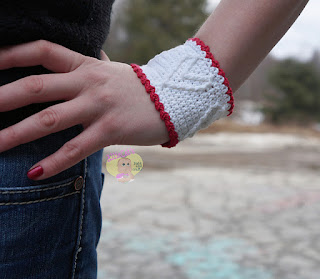 http://www.ravelry.com/patterns/library/cupid-cuff