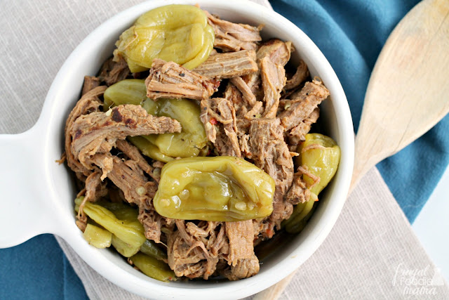 It only takes 4 ingredients & a few minutes of prep to make this juicy and flavorful Slow Cooker Italian Pepperoncini Shredded Beef.