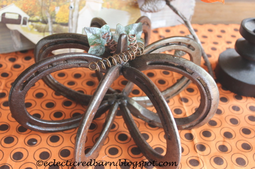 Horseshoe pumpkin with leaves and springs