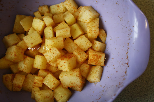 Toss the potatoes in onion and garlic powder and paprika