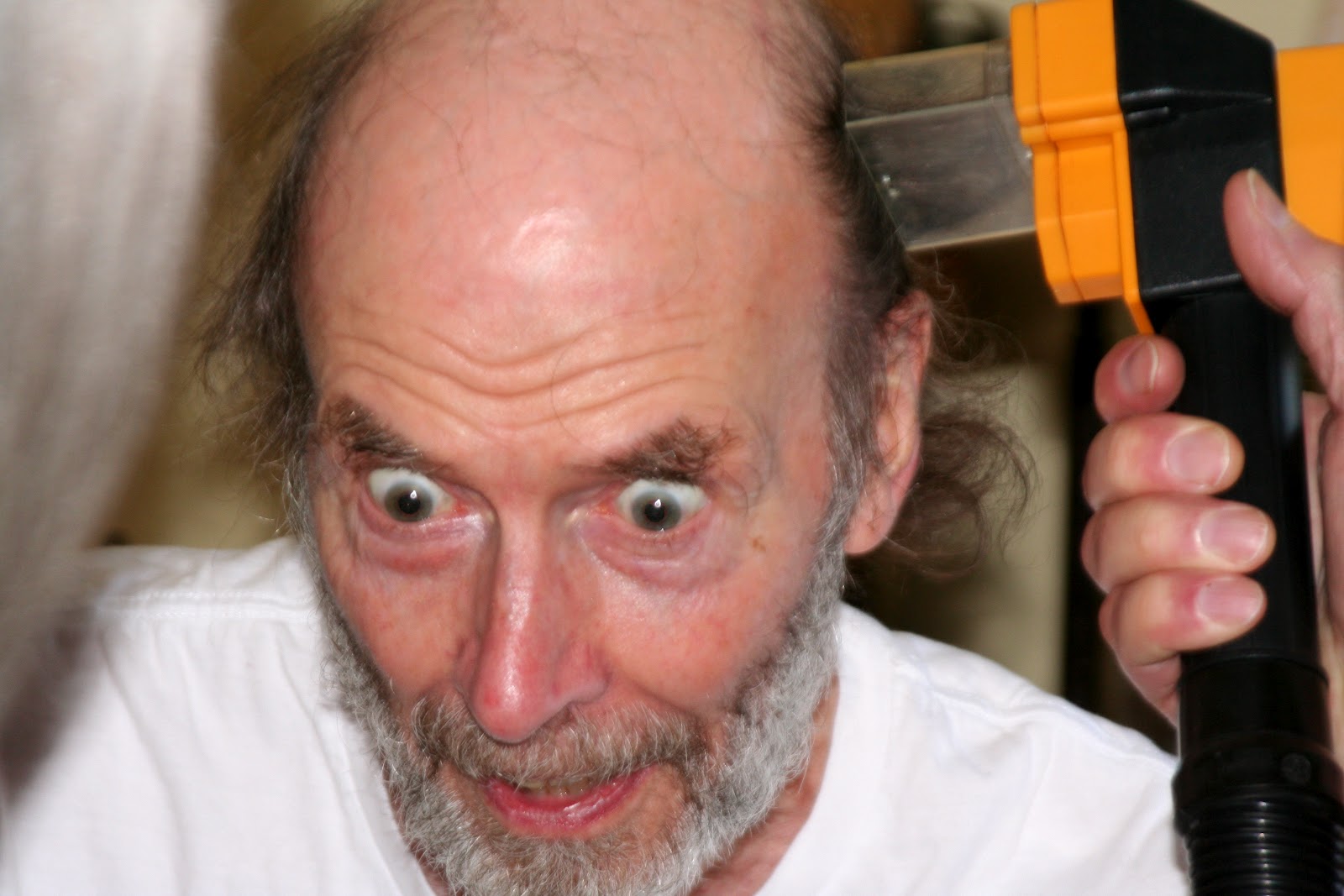 Circle of Friends Daily Photos getting first haircut using the flowbee