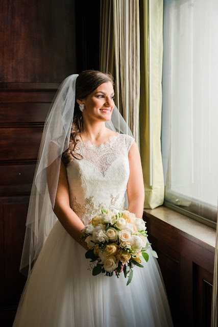 Winter bride with white and gold bridal bouquet