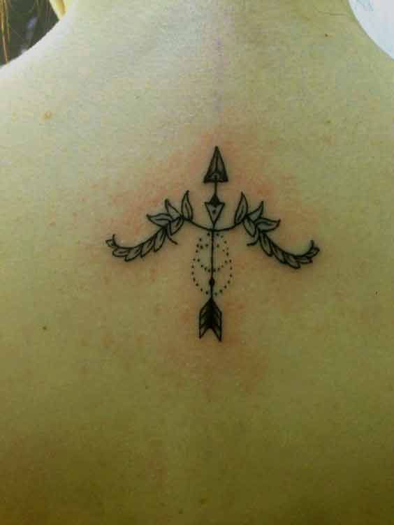 Small Sagittarius bow and arrow flowers tattoo