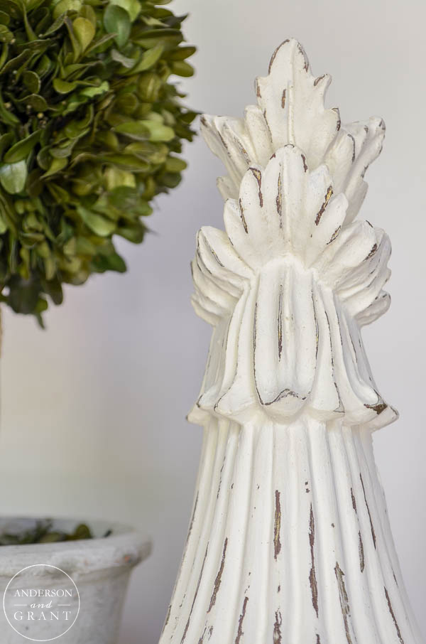 Carved wood corbel with distressed paint.  |  www.andersonandgrant.com