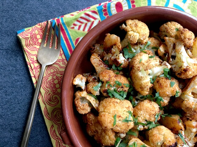 Spice roasted cauliflower is slightly sweet and mildly spiced with both hot and smoked paprika and a hint of cinnamon. Tossing it with olive oil and melted butter before roasting adds a richness to the flavour, turning sometime ho-hum cauliflower into an extra tasty side dish. 