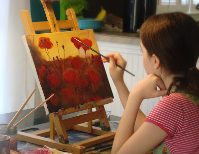 girl child painting red flowers
