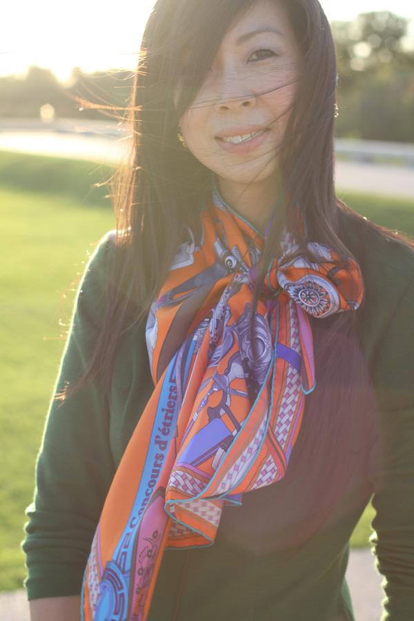 green wool dress, hermes orange scarf, coach legacy ali bag, cognac boots, cindy adams lion earrings