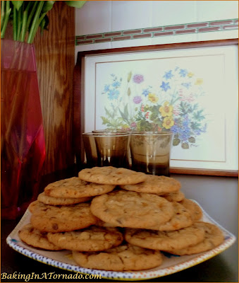 Crunchy Peanut Butter Suprise Cookies, a crunchy peanut butter cookie with mini chocolate chips and a few surprises inside | Recipe developed by www.BakingInATornado.com | #recipe #cookies #chocolate