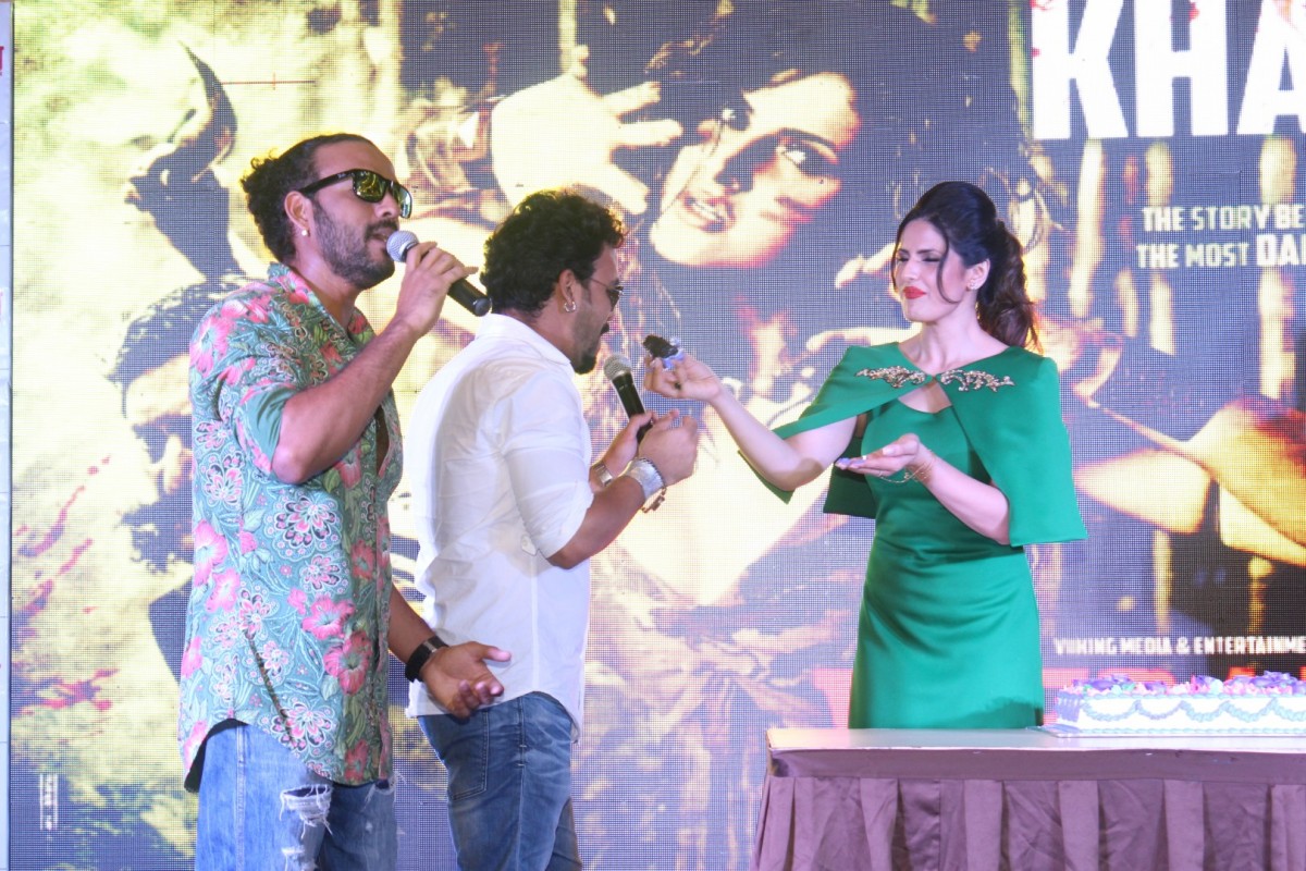 Zareen Khan Displays Her Sexy Legs In a Green Short Dress At The â€œKhallasâ€ Song Launch From Film Veerappan