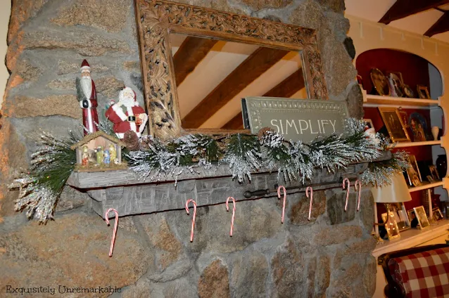 Candy Canes and garland on fireplace mantel