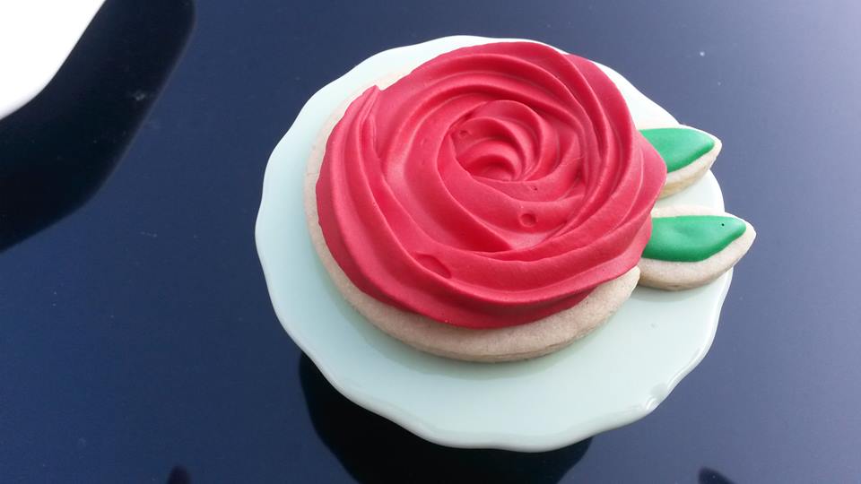 Chick 'n Biscuits Swirl Rose Cookies using Royal Icing.
