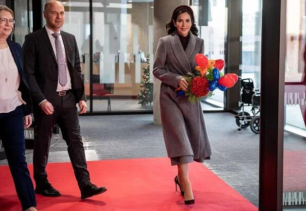 Crown Princess Mary attended the opening of Viborg Regional Hospital's new emergency center. burgundy blouse, grey midi dkirt, grey wool coat