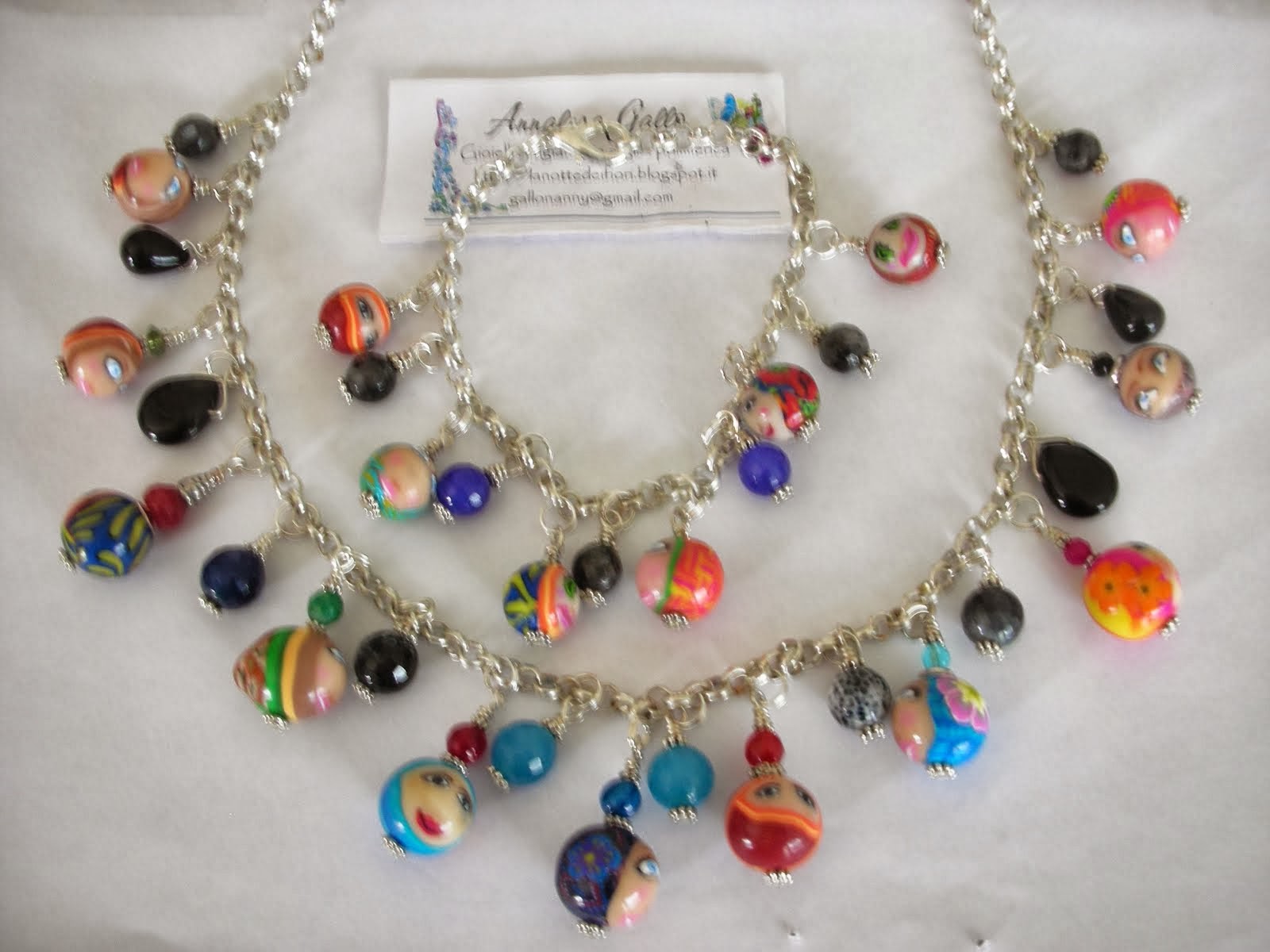 collana e bracciale con perle in fimo decorate con murrine faccine