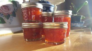 jars of sweet orange marmalade on a table