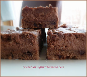 Chocolate Cheesecake Squares with Mocha Cookie Crust: a quick and easy chocolate cheesecake center baked in a chocolate coffee cookie crust and topped with dollops of the mocha cookie dough | www.BakingInATornado.com | #recipe #dessert