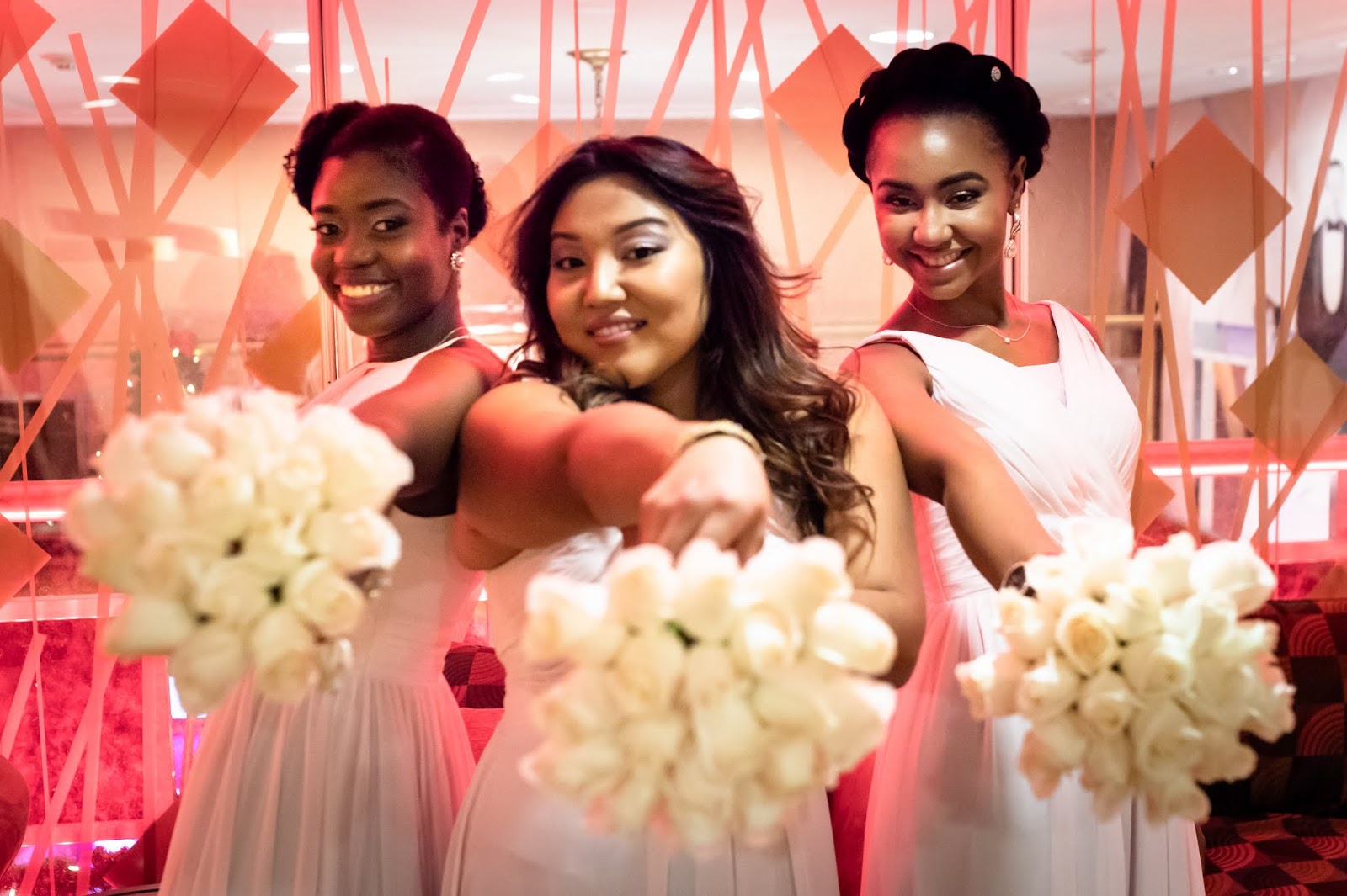 Beautiful Maids Of The Bride Displaying Colorful Flowers.