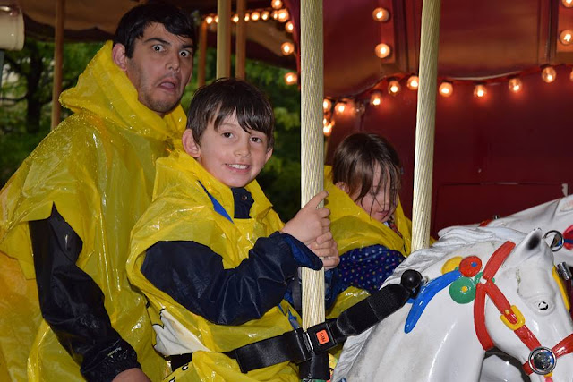 smiles and funny faces on the carousel at legoland
