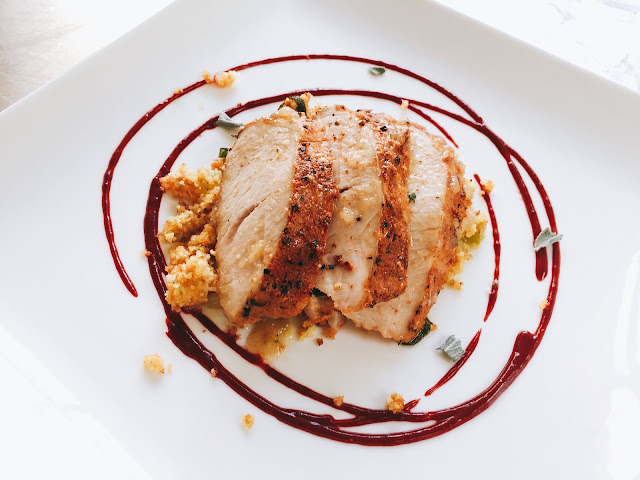 Oven Roasted BBQ Butter Iverstine Farms Turkey Breast served atop Cornbread Dressing  with a Cranberry Beet Chipotle Sauce