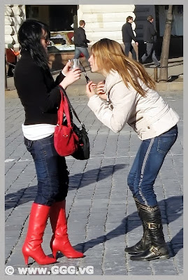 Girl wearing red high heels boots