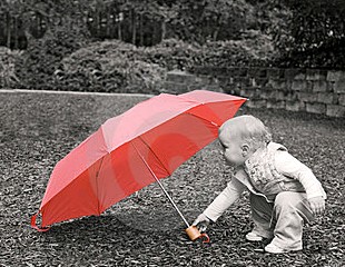 child and red umbrella