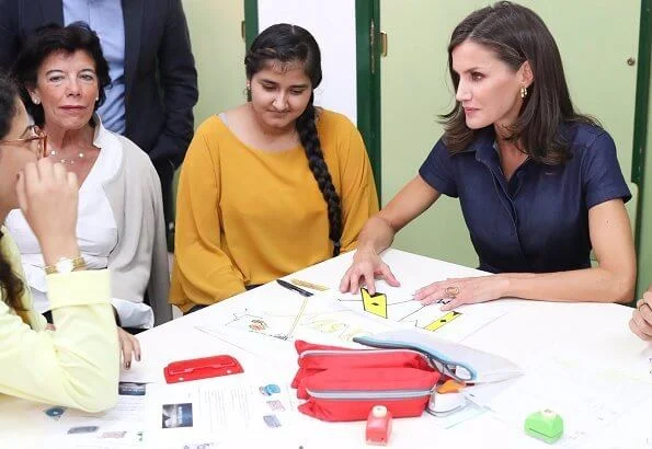 Queen Letizia wore Carolina Herrera denim shirt dress. Carolina Herrera clutch. President Ximo Puig