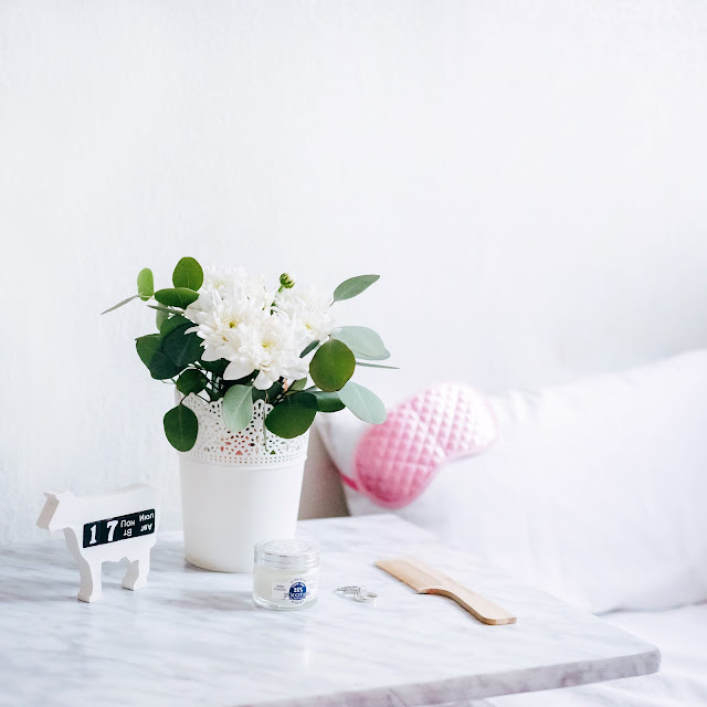 marble bedside table with flowers