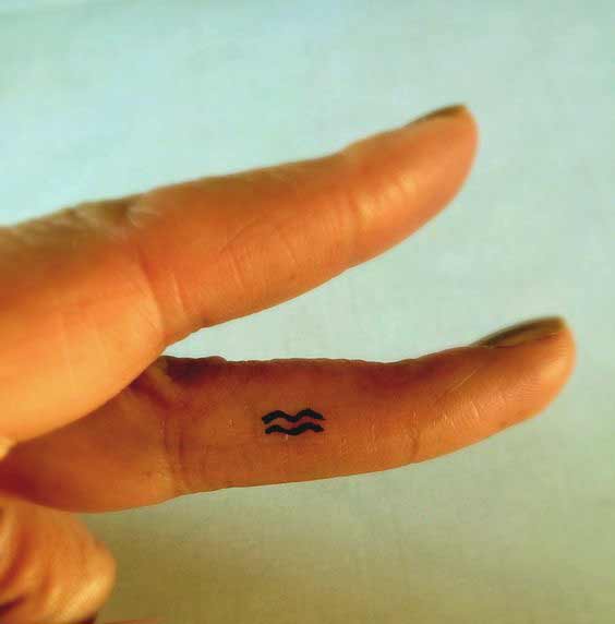 Aquarius symbol tattoo design on finger